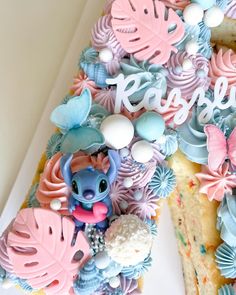 a cake with frosting and decorations on it