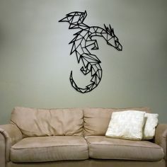 a living room filled with furniture and a metal wall mounted seahorse on the wall