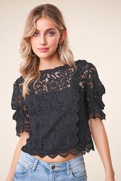 Add a touch of elegance to any outfit with the 'Romeo Romeo' balloon sleeve lace blouse! Dainty eyelash lace shapes a crew neckline, atop a contrasting crochet lace bodice framed by short, balloon sleeves. Cropped, scalloped hem finishes the flirty look. - Model is 5'9" and wearing size small. Available in black. 100% polyester. Imported. Chic Scalloped Lace Top For Fall, Crochet Lace Top For Brunch, Black Lace Top With Crew Neck, Elegant Black Tops With Scalloped Lace, Elegant Crochet Lace Top For Brunch, Elegant Black Top With Scalloped Lace, Elegant Black Scalloped Lace Top, Chic Scalloped Lace Fall Blouse, Spring Lace Trim Crew Neck Top