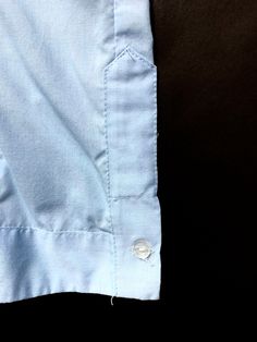 "Vintage Guayabera Loop Collar Shirt ~ estimated size L Color: Light to medium blue. Fabric: Not tagged. Either 100% cotton or a \"permanent press\" cotton blend. Condition: Excellent, gently worn condition. Size: Estimated size L. PLEASE OBSERVE THE MEASUREMENTS: Chest (underarm to underarm): 24\" Sleeve (shoulder to cuff): 25.25\" Shoulders (seam to seam): 20.25\" Length (neck seam to bottom hem): 29.5\" Shipping weight (includes packaging): 12 oz Please see our store policies for details on s Light Blue Cotton Blouse With Pockets, Blue Cotton Blouse With Placket, Light Blue Embroidered Cotton Shirt, Light Blue Cotton Embroidered Shirt, Blue Cotton Blouse With Button Cuffs, Guayabera Shirt, Camp Wedding, Boiler Suit, Sparrows