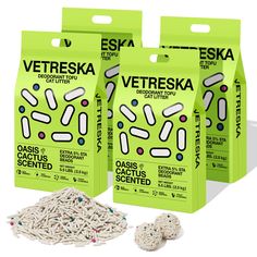 three bags of vetreska cat litter sitting next to each other