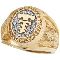 a men's ring with the letter t in gold and white diamonds on it