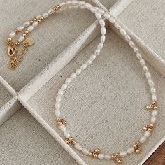 The Livia Beaded Necklace is crafted from natural freshwater pearl (with natural imperfections) and sprinkled with 14k gold-plated beads, creating a delightful addition to any outfit. MATERIAL: Natural Freshwater Pearl & Brass FINISHING: 14-Karat Gold Plated LENGTH: 40cm with extensions at 5cm (total length 45cm) PEARL SIZE: Approx. 3.5mm *Natural materials like pearls have natural growth marks and imperfections, which are their individual beauty and character, ensuring that no two pearls are alike and not considered as quality issues.* ---------- *Related Necklaces in the picture* Natural Pearl Beaded Choker https://dermomento.etsy.com/de-en/listing/1723118158/daily-natural-pearl-beaded Natural Pearl Beaded Necklace https://dermomento.etsy.com/de-en/listing/1685664199/daily-gold-plated-fr Pearl White Necklace With Tiny Beads As Gift, Pearl Necklace With Gold Beads For Gift, Pearl White Necklace With Gold Beads As Gift, Yellow Gold Pearl Necklace With Gold Beads As Gift, Pearl Beaded Necklace With Gold Beads As Gift, Gift Pearl Necklace With Gold Beads, Gold Pearl Necklace With Tiny Beads For Gift, Gold Pearl Necklace With Tiny Beads As Gift, Yellow Gold Beaded Pearl Necklace As Gift