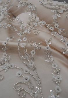 "Luxury embroidered lace fabric for wedding gown. Lace fabric with overlaid elements. 3D effect lace is a fabric of incredible magic. Delicate design with small flowers, embellished with beads and sequins. Such fabric will help to bring to life a completely graceful and sensual image of the bride. Lace width( 53\") 1.35 m. The price is for: 1) 0.5 yard - 82$ 2) 1 yard - 155$ Composition: 50% nylon, 50% polyester Width 1.35 (53 \") You can pick up the buttons in the color of the fabric here: http Luxury Embroidered Fabric For Reception, 3d Lace Fabric, Wedding Dress With 3d Embroidery In Organza, Elegant Organza Fabric With 3d Embroidery, White Embellished Organza Embroidered Fabric, Elegant Floral Embroidered Fabric For Banquet, Wedding Embellished Lace Embroidered Fabric, Wedding Embellished Lace Fabric, Elegant Tulle Fabric With 3d Lace Embroidery