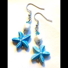 Detailed Aqua Blue Ceramic Starfish Focals Accented By White Coral Nuggets And Aqua Crystal Beads. Width .75”. Length Incl. Silver Tone Hooks 2.1”. Summer Starfish Charm Dangle Earrings, Blue Starfish Charm Jewelry For Summer, Summer Dangle Earrings With Starfish Charm, Blue Summer Jewelry With Starfish Charm, Summer Blue Starfish Charm Jewelry, Blue Star Shaped Jewelry For Vacation, Blue Star Jewelry For Vacation, Ocean-inspired Blue Earrings With Ear Wire, Blue Starfish Jewelry For Beach