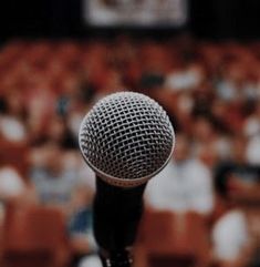 a microphone that is sitting in front of an audience