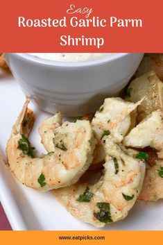 roasted garlic parm shrimp on a white plate with dipping sauce in the background and text overlay that reads easy roasted garlic parm shrimp