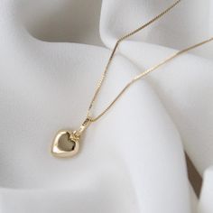 "14k Solid Gold Heart Pendant, 14k Solid Gold Puffy Heart Pendant, Valentine's day gift . . . * Gold KT: 14K Gold * Gold Color: Yellow Gold * Chain: 1mm Box Chain * Stamp: 14k * Never gold filled or plated * Packaged With Free Gift Box . . . * Pendant measurement including the bail: (17 x 9 mm) . . . If you have any questions, just hit the \"Message the Seller\" button ( bottom right of the page) and we will get back to you within a few hours. . . . Mailed in a cute white package great for gifting. ,  14k Solid Gold Puffy Heart Necklace, Small Heart Necklace, 14k Yellow Gold Heart Pendant, 14k Heart Pendant, Gold Heart Pendant, Dainty Heart Charm, Great Gift for Her. A Perfect 14K Gold gift.  Christmas Gift, Christmas gift for her, Christmas gift for him. Valentine's day gift, Gift for Val Valentine's Day Gold Plated Heart Cut Necklace, 14k Gold Pendant Charm Necklace For Valentine's Day, Tarnish Resistant Heart Cut Heart Necklace For Gift, Tarnish Resistant Heart Cut Necklace For Gift, Heart Shaped 14k Stamped Jewelry For Valentine's Day, 14k Gold Heart Necklace Tarnish Resistant For Gift, Gold Plated Heart Necklace For Valentine's Day, 14k Gold Tarnish-resistant Heart Necklace Gift, 14k Gold Round Heart Necklace For Valentine's Day