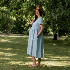 📏 FIT Maria dress has a relaxed and roomy fit, is true to size, and designed with a higher waistline to accentuate a pregnant belly. We suggest taking your usual size in this style to achieve the look as shown in pictures. Please note, the garment naturally softens and relaxes as you wear it throughout the day. It'll become more comfortable as you move around in it. Before placing an order, always check the approximate measurements of the finished garment given among the pictures. If you have d Blue Nursing-friendly Maternity Dress With Short Sleeves, Blue Nursing Friendly Maternity Dress With Short Sleeves, Blue Short Sleeve Nursing-friendly Maternity Dress, Nursing Friendly Knee-length Summer Dresses, Blue Nursing Friendly Short Sleeve Maternity Dress, Blue Short Sleeve Maternity Dress, Nursing Friendly, Short Sleeve Maternity Dresses For Summer, Summer Maternity Dress, Nursing Friendly, For Daywear, Summer Maternity Dress Nursing Friendly Daywear