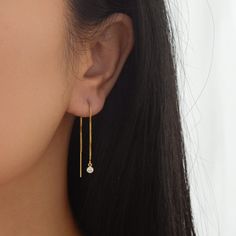 Sleek and contemporary, this pair of threader earrings feature a shiny gold chain from which hangs tiny but brilliant cubic zirconia charm. This listing is for a pair of earrings. All materials are 14K gold filled and are tarnish resistant, water resistant, and hypoallergenic. Gift box included with purchase. Chain measures 8 cm long with a 20 gauge. Cz measures 3.8mm in diameter --------------------♥ PROMOS ♥-------------------- Want 10% off? Join the mailing list by visiting http://bit.ly/vede Minimalist Dangle Linear Earrings As Gift, Gift Linear Drop Earrings With Adjustable Chain, Dainty Round Threader Earrings For Gifts, Dainty Round Threader Earrings Gift, Handmade Elegant Dangle Threader Earrings, Dainty Single Linear Earring As Gift, Everyday Drop Earrings With Adjustable Chain, Everyday Linear Dangle Earrings With Adjustable Chain, Elegant Hoop Earrings With Adjustable Chain As Gift