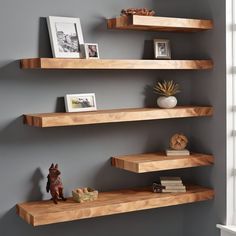 10 FAQs About Floating Shelves Q: "What makes floating wooden shelves a great addition to home decor?" A: Floating wooden shelves provide a versatile and stylish solution for home decor by offering functional storage without sacrificing aesthetics. They can showcase decor items, books, and collectibles, enhancing the overall look of any room.  Q: "How can white floating shelves contribute to a clean and stylish interior?" A: White floating shelves contribute to a clean and stylish interior by adding a sense of lightness and simplicity. They create a neutral backdrop for displaying colorful items, making the space visually appealing.  Q: "In what ways can floating bookshelves be utilized for both storage and display purposes?" A: Floating bookshelves are excellent for storage and display. T Floating Shelves For Corner Wall, Floating Shelves Different Lengths, Thick Wood Shelves Living Room, Offset Wall Shelves, Floating Wood Shelves Office, Wall Book Display Ideas, Modern Bedroom Shelving, Wood Wall Shelf Ideas, Long Floating Shelves Living Room Modern