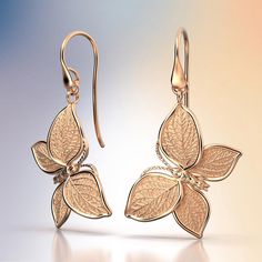 Experience Italian craftsmanship at its finest with our exquisite gold dangle drop earrings. The centerpiece of these earrings is a delicate butterfly with elegantly crafted leaves as its wings, creating a captivating and nature-inspired design. Available in both 14k and 18k gold, these earrings bring a touch of luxury and nature's beauty to your style. Elevate your look with the perfect blend of Italian artistry and organic elegance, shop now to adorn yourself with this unique masterpiece. 14k Butterfly Dangle Earrings, Delicate Butterfly, Gold Dangle Earrings, Italian Craftsmanship, Italian Jewelry, Nature Inspired Design, Gold Butterfly, Gold Earrings Dangle, A Butterfly