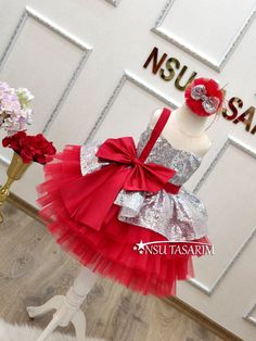 Christmas dress. Gift package. Baby girl dress. Holiday dress. Silver Sparkle Christmas dress.Elevate your little one's holiday celebrations with our enchanting Shimmering Scarlet baby dress. This delightful knee-length Christmas costume is designed to make her the star of the holiday season. With its stunning combination of bright red and shimmering silver, adorned with a large red bow on the bodice and a cascading red tulle skirt, it's the perfect choice for creating cherished holiday memories Princess Style Holiday Dress, Princess Style Christmas Party Dress, Holiday Princess Dresses, Pink Princess Dress For Christmas Party, Holiday Princess Dress For Party, Pink Princess Christmas Dress, Pink Christmas Dress For Dress-up, Festive Holiday Dress With Ruffles For Dress-up, Festive Ruffled Dresses For Party Season