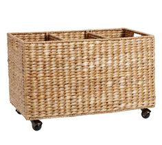 a wicker basket on wheels with handles