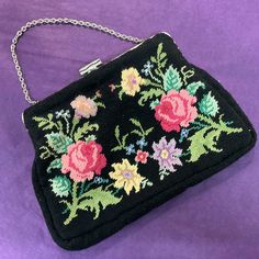 Add a classic touch of vintage style and elegance to any outfit with this adorable embroidered evening bag. The bag is made up from panels of hand worked petite pointe floral taspestry to both the front and back in vibrant shades of pink,green , yellow and mauve onto a striking black background. It has an ornate silver tone metal frame with a rectangular push clasp and a short chain strap. Inside is lined in black velvet.  Measures 7.5" x 5" x 1" at the sides and base and the bag remains in exce Pink Green Yellow, Frame Wedding, Ornate Frame, Gifts For Mum, Clutch Handbag, Vintage Stil, Chain Strap, Green Yellow, Black Velvet