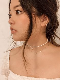 Minimalist design with a statement. This stunning choker is handcrafted with handpicked tiny freshwater pearls and 14K gold-filled materials, making it long-lasting and perfect for sensitive skins. Each pearl is unique and slightly varies in size and shape — and that's the beauty of it. …………………………………. I T E M D E T A I L S • Genuine freshwater pearls measure 4 mm • Comes with 2-inch extender chain for a perfect fit • 14K Gold Filled• Tarnish-resistant, showerproof, and hypoallergenic• Nickel, le Pearl Lariat Necklace, Pearl Choker Necklace, Pearl Hoop Earrings, Pearl Choker, Freshwater Pearl Necklaces, Elegant Accessories, Lariat Necklace, Gold Filled Jewelry, Gold Plated Jewelry