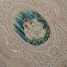 an ornate doily with two children on it