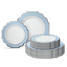 blue and white dinnerware set with scalloped rims on each plate,