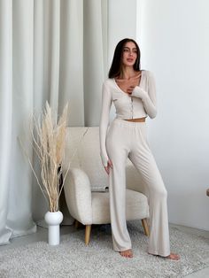 Meet our collection of knitted viscose. A soft and pleasant to the touch set, which is nice to wrap yourself in after a working day 🫶🏻 Natural home set / pajama pants + top with long sleeve viscose High-rise pants, soft elastic and perfect length, loose cut, so they are very comfortable. The top nicely delineates and does not constrain movements. A great option for clothes for home, for sleep, a great gift for a birthday, anniversary, wedding, anniversary or any other holiday for a mother, beloved wife, girlfriend, daughter, sister, close friend buy at More. Colors: milky Model is wearing size XS-S and is 5'6"/172cm (86/60/92) XS Bust - 32.3 - 33.7 inches (82-86 cm) Waist - 23.6 - 26 inches (60-66 cm) Hips - 34.6 - 37 inches (88-94 cm) S Bust - 33.7 - 35.5 inches (86-90 cm) Waist - 26 - Beige Long Sleeve Sets For Home, Soft Fitted Sleepwear For Lounging, Cozy Fitted Loungewear Sets, Relaxed Fit Viscose Sleepwear For Loungewear, Beige Casual Pajama Party Sets, Casual Beige Sets For Pajama Party, Casual Beige Pajama Party Sets, Casual Fitted Soft Sleepwear, Chic Matching Set For Loungewear