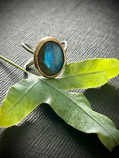 Handcrafted Sterling Silver and Gold Filled  Ring with Labradorite .  Approximate size 6.75 Handmade Spiritual Open Opal Ring, Handmade Oval Crystal Ring For Jewelry Making, Handmade Minimalist Moonstone Ring, Handmade Artisan Crystal Ring, Handmade Minimalist Oval Crystal Ring, Handmade Minimalist Round Opal Ring, Hand Forged Artisan Moonstone Ring Gift, Artisan Hand Forged Moonstone Ring Gift, Unique Round Opal Ring For Healing