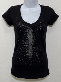 Fabric comprised of 95% cotton and 5% spandex.  Handmade rhinestone t-shirts made in the United States with quality rhinestones. Machine washable. T-shirt style is a fitted V-neck cap sleeve. Size Range:         XXS = 2         XS = 4         S = 6         M = 8         L = 10         XL = 12 Fitted Casual Tops With Rhinestones, Fitted Casual Top With Rhinestones, Casual Fitted Tops With Rhinestones, Casual Stretch Tops With Rhinestones, Cotton Tops With Rhinestones And Short Sleeves, Stretch Crew Neck Top With Rhinestones, Fitted Cotton Top With Rhinestones, Stretch Black Tops With Rhinestones, Cotton Short Sleeve Top With Rhinestones