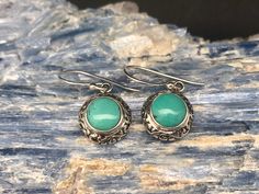 Turquoise Earrings // Sterling Silver // Ornate Bali Setting // Turquoise Jewelry Weight: 5 grams Length: 1.2 inches Stone: Turquoise Hallmark 925 Finish: shiny, oxidized Note: please pay attention to the size and weight before purchasing. This is a very delicate and light weight earring. Round Turquoise Earrings For Gift, Turquoise Round Pierced Jewelry, Hypoallergenic Turquoise Oval Earrings, Turquoise Cabochon Drop Earrings, Vintage Turquoise Round Earrings, Nickel-free Turquoise Sterling Silver Earrings, Artisan Turquoise Nickel-free Earrings, Artsy Nickel-free Turquoise Earrings, Nickel-free Turquoise Crystal Earrings For Gift