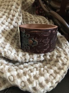 "🔸🔸orders are delayed by a few days this week. Thank you for your patience Country leather bracelet cuff, western jewelry Embossed distressed genuine brown leather 1 1/2\" strap has been adorned with an oval southwestern silver concho which sets on a detailed antiqued copper filigree which has been given a rich patina. It is attached to the leather with two antiqued copper rivets. One antiqued copper snap has been placed to fit up to a 7 1/4\" wrist. I can add another snap if you would like a Cowgirl Bracelets, Chunky Bracelet, Santa Clarita, Chunky Bracelets, Bracelet Leather, Bracelet Cuff, Leather Cuffs Bracelet, Western Jewelry, Dark Brown Leather