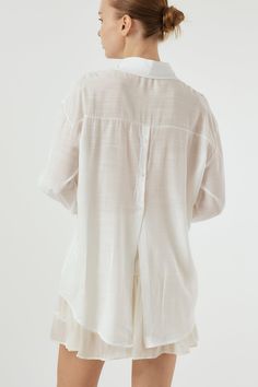 Sydney Back Open Shirt Button down style. Sheer, oversized shirt with open back detail. Professional Clean Only / Do Not Tumble Dry Model's height is 5′ 7″ (157cm) Bust 31in Waist 23in Hip 34in and wearing S/M White Blouse With Shirttail Hem And Placket, Oversized White Blouse With Placket, White Button-up Tops For Layering, Oversized Button-up Blouse, Summer Tops With Button Closure For Layering, Oversized Effortless Shirt With Shirttail Hem, Spring Daywear Shirt With Shirttail Hem, Spring Layering Shirt With Collar, Oversized Blouse With Button Closure For Daywear