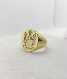 Gold Men Signet Ring - Coat of Arms Ring - Armorial Ring - Family Crest Ring Dimensions: 1.9 x 1.6cm of oval face Band Width: 7mm Your custom signet ring can be made out of 9K Solid Gold, 14K Solid Gold, or 18K Solid Gold. Leave us a message with your desired finish of the band. (Yellow Gold, White Gold, or Rose Gold). ♠ Face can be made in 3D relief or embossed in seal ring type. ♠ We discuss together your ideal jewelry design, in shape, style, and details. ♠ Our customers participate and invol Ceremonial Engraved Open Signet Ring, Classic Formal Rings With Coat Of Arms, Ceremonial Jewelry Ring With Engraving Option, Formal Yellow Gold Engraved Ring With Coat Of Arms, Heirloom Oval Signet Ring With Coat Of Arms, Antique Tarnish Resistant Signet Ring For Anniversary, Timeless Polished Rings For Ceremonial Occasions, Heirloom Signet Ring With Coat Of Arms, Heirloom Oval Signet Ring For Ceremonial Occasions