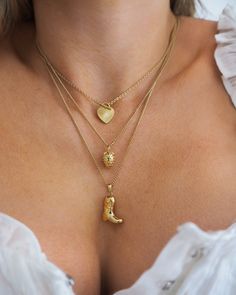 This vintage-inspired strawberry charm necklace is the perfect accessory for a fun, feminine look. Wear the delicate piece alone or layer with your favorite necklaces. 14k gold plated + palladium plating with brass base Chain measures 17" + 2" extender Spring clasp Charm measures approx 10mm by 8.5mm Protective coating, water resistant Dainty Gold-tone Brass Necklaces, Dainty Gold-tone Brass Necklace, Dainty Gold Plated Chain Necklace, Sterling Silver Charm Necklace With Vintage Charm, Gold Dainty Charm Necklace With Vintage Charm, Dainty Gold Charm Necklace With Vintage Charm, Dainty Necklace With Heart Pendant And Vintage Charm, Dainty Necklace With Vintage Heart Pendant, Dainty Gold-tone Charm Necklace With Round Pendant