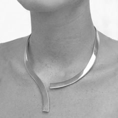 Detailed Description: This solid open fronted Statement Sterling Silver Drop Choker Necklace, with its classic curved design and discreetly hinged back is the perfect statement piece for that special occasion. If you would like this Statement Sterling Silver Drop Choker Necklace in a gold or rose gold finish, please call us and we will offer this bespoke service. You may also be interested in: Scissors Silver Choker Necklace Made from: Sterling silver. Measurements: Choker necklace height: approx. 18.0cm Choker necklace width: approx. 13.0cm Geometric Bangle, Arm Cuff Bracelet, Silver Gold Necklace, Sterling Silver Choker, Silver Choker Necklace, Silver Necklace Statement, Stylish Necklace, Silver Choker, Modern Necklaces