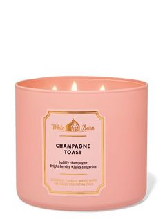 a pink candle that is sitting in front of a white background with the words champagne toast on