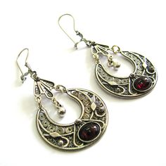 Beautiful ethnic women's jewelry filigree earrings, made from high-quality 925 sterling silver. The round dangle earrings are lightweight, which allows you to wear the earrings for a whole day. The earrings are inlaid with gemstones of your choice Onyx, Garnet, Amethyst, or Azurite gemstones. ♥ Wrapped in a gift box. ABOUT THE ITEM ----------------------- DIMENSIONS ♥ Length 2.2" (4cm) with ear hoop. ♥ Width 1.2" (3cm). ♥ weight 9 grams. ♥ Crafted from high-quality 925 Sterling Silver in a speci Traditional Oval Filigree Earrings, Ornate Round Chandelier Earrings With Intricate Design, Ornate Oval Pierced Earrings, Ornate Nickel-free Chandelier Earrings, Ornate Round Earrings With Oxidized Finish, Elegant Sterling Silver Danglers With Oxidized Finish, Ornate Oxidized Round Earrings, Elegant Oxidized Sterling Silver Danglers, Oval Filigree Earrings