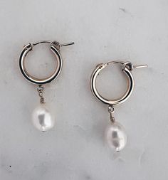 Pretty white & shimmery baroque pearls are hand wired onto 14k gold filled huggie hoops. Hoop is about 14mm and total length is about 1.25 inches. Safe for sensitive skin Tarnish Proof 14k Gold Filled Hoop Earrings With Pearl Charm, 14k Gold-filled Huggie Hoop Earrings With Pearl Charm, 14k Gold-filled Pearl Drop Huggie Jewelry, 14k Gold Filled Pearl Drop Huggie Jewelry, Everyday Teardrop Huggie Earrings With Pearl Drop, Small Hoop Pearl Drop Earrings In 14k Gold Filled, 14k Gold Filled Pearl Charm Hoop Earrings, Everyday Hoop Earrings With Pearl Charm, Everyday Small Hoop Pearl Chain Jewelry