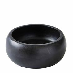 a black bowl sitting on top of a white surface