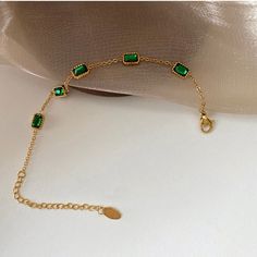 This bracelet is screaming LUXURY! Beautiful Zirconia mixed with rugged lock and chain! . One of a kind design that is perfect for stacking or wearing alone. This piece is made to last, hypoallergenic & waterproof. 316L Stainless Steel 18K Gold Plated, Cubic Zirconia 6 inches long +2 inches ext Green Adjustable Chain Bracelet, Trendy Green Metal Bracelets, Trendy Rectangular Bracelet With Strap, Green Chain Bracelet Jewelry, Trendy Tarnish Resistant Rectangular Bracelets, Trendy Green Chain Bracelet As Gift, Trendy Green Chain Bracelet For Gift, Everyday Green Jewelry With Chain, Everyday Green Chain Jewelry