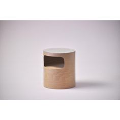 a wooden stool with a hole in the middle on a white background, it appears to be made out of plywood