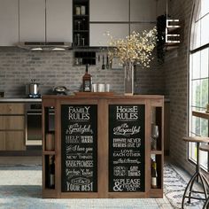 a kitchen with an island and chalkboard menus on the wall next to it