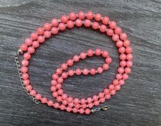 Handmade Natural Coral Pink Orange Necklace, Salmon jewelry, beaded Gemstone strand.  One of a kind. This charming necklace is sure to bring happiness into your life!  You’ll get the same as on the photos necklace. The necklace is 29.5 inches long, plus extender 2 inches, therefore total length is 31.5 inches long. Each Coral bead is 5.5 mm.  This clasp is silver plated. The necklace will arrive in a complimentary jewelry box, ready for gift giving.To see more jewelry created by VeraidaGifts,  h Double Strand Beaded Crystal Necklace Gift, Coral Beaded Necklaces With Faceted Beads As Gifts, Spiritual Single Strand Beads As Gift, Double Strand Faceted Beads Necklace As Gift, Coral Round Beaded Necklace Gift, Coral Beaded Necklaces As Gift, Gift Crystal Necklace With Single Strand Of Round Beads, Single Strand Beaded Necklace For Gifts, Faceted Double Strand Beads For Gift