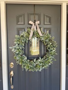 a wreath is hanging on the front door