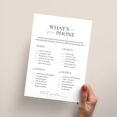 someone holding up a printable what's for phone