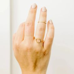 This is one of our favorite rings! It's just such a cool shape. Simple Adjustable Round Rings, Minimalist Gold Crystal Ring With Simple Design, Minimalist Round Band Crystal Ring For Everyday, Gold Crystal Ring With Simple Design, Adjustable 14k Gold Midi Rings, Hypoallergenic 14k Gold Round Midi Rings, Adjustable Oval Initial Ring Minimalist Style, Gold Crystal Ring With Round Band For Everyday, 14k Gold Crystal Ring For Everyday