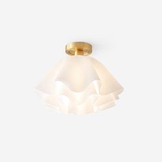 a light that is on top of a white wall mounted ceiling fixture in an empty room