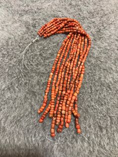 10 Strands Of Old Coral Beads From Morocco The Color is an Orange Red The little black spots in this coral are an indication of age Dimensions : the smallest bead is 3.9mm x 3.8mm the largest bead is 7mm x 6,7mm Length of Strand : 26cm Weight : 117g Moroccan Jewelry, Natural Coral, Coral Beads, Black Spot, Red Coral, Orange Red, Chain Styles, Photo Jewelry, Embroidered Friendship Bracelet