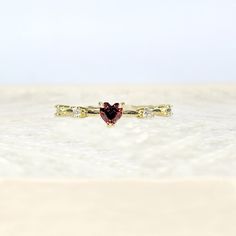 Petite 18k Yellow Gold Heart Shaped Ruby July Birthstone Delicate Dainty Ring Size 7 18k Yellow Gold Plated This Ring Is True To Its Beauty!!! The Detail And Sheer Sparkle Is Absolutely Stunning!! Wear Your Heart On Your Finger, Or Gift This To The Love Of Your Life! This Heart Shaped Solitaire Gemstone Sits Pretty On A 18k Yellow Gold Plated Band. This Lab Created Ruby Is A Shiny Red Gem Teeming With Fire And Brilliance. #Goldplated #Ringsize7 #Size7ring #Julybirthstone #Ruby Red Fashion Gold P Valentine's Day Dainty Cubic Zirconia Rings, Dainty Heart Ring With Cubic Zirconia For Gift, Dainty Heart Ring With Cubic Zirconia As Gift, Dainty Cubic Zirconia Heart Ring For Gift, Gold Heart Ring With Gemstone For Valentine's Day, Gold Gemstone Ring For Valentine's Day, Gold Heart Ring With Center Stone For Valentine's Day, Gold Gemstone Heart Ring For Promise, Elegant 14k Gold Heart-shaped Birthstone Ring