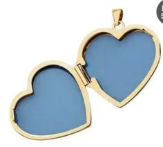 A classic heart shaped locket, crafted in 14K yellow gold. The inside holds two framed hearts that can hold your precious photo memories. If you desire engraving on outside or inside - enquire on pricing and scale of your project. Details: Metal: 14K Yellow Gold Weght: 2.89 grams Measurement: Height: 6.75mm Length: 28.4mm Width: 23.6mm Finish: High Polish Holds two photos Yellow Gold Double Heart Locket Necklace With Charm, Double Heart Locket Necklace For Anniversary, Yellow Gold Open Heart Locket Necklace Keepsake, Yellow Gold Double Heart Locket Necklace, Elegant Double Heart Locket Necklace For Memorial, Heart Shaped Locket, Yellow Heart, Photo Memories, Heart Locket