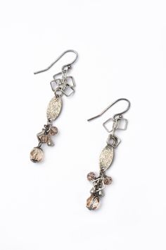 A fun pair of dangle earrings in a handcrafted cluster design. This artisan design rests at approximately 2.25" from sterling silver ear wires. Antique Silver Plated Brass (Lead & Nickel Free) Crystal 2.25" with sterling silver ear wires We hand select our natural materials, thus there may be slight variations in color and/or size that will not detract from the overall aesthetic. Our unique handcrafted designer jewelry for women is made in America, each design created individually in our persona Floyd Va, Cluster Design, Designer Handmade Jewellery, Artisan Design, Cluster Earrings, Designer Jewelry, Ear Wires, Windsor, Natural Materials