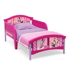 a child's bed with minnie mouse and friends on it