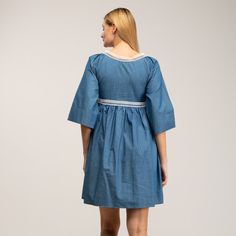 Boho-chic style with a modern accent. This denim mini dress features a spectacular embroidery detail in the chest, as well as romantic oversize french sleeves  and tassels to add more charm to this beautiful dress. Got any cowboy boots? It will be the perfect match! 100% Cotton. Wash Machine  30º ,  Press Medium  Temperature, Do  not  use spin-dry, Do not Bleach Chic Cotton Mini Dress With Floral Embroidery, Chic Floral Embroidery Cotton Mini Dress, Spring Embroidered Relaxed Fit Dress, Floral Embroidered Cotton Mini Dress For Brunch, Cotton Mini Dress With Floral Embroidery For Brunch, Cotton Dresses With Embroidered Hem, Chic Embroidered Dress For Daywear, Embroidered Mini Dress For Daywear, Knee-length Cotton Dress With Embroidered Hem