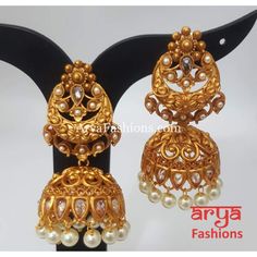 Golden Triple Jhumka Earring with golden beads Premium Quality Kundan Jhumka Earrings Length: Approx. 2.65" Light-weight Push-Back closure Gold Finish on high-quality brass as the base metal, Kundan stones and Pearls Suitable for any traditional or contemporary attire and occasion In-stock & ready-to-ship **Color may vary slightly due to photography and lighting. Gold Danglers For Wedding And Navratri, Traditional Heavy Gold Bridal Earrings, Gold Chandbali Jhumkas For Wedding, Heavy Gold Chandbalis, Heavy Gold Earrings For Festive Occasion, Gold Bridal Earrings With Latkans In Temple Jewelry Style, Gold Temple Jewelry Danglers For Festive Season, Traditional Gold Danglers For Navratri, Festive Gold Temple Jewelry Danglers